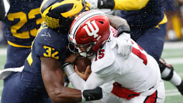 Oct 14, 2023; Ann Arbor, Michigan, USA; Michigan Wolverines defensive end Jaylen Harrell (32) sacks Indiana Hoosiers quarterback Brendan Sorsby (15) in the second half at Michigan Stadium. Mandatory Credit: Rick Osentoski-USA TODAY Sports