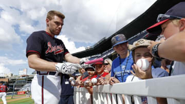 Jul 15, 2016; Atlanta, GA, USA; Atlanta Braves first baseman Freddie Freeman (5) signs autographs for fans before their game against the Colorado Rockies at Turner Field. Mandatory Credit: Jason Getz-USA TODAY Sports