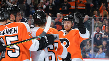 PHILADELPHIA, PA - MARCH 05: Michael Raffl #12 of the Philadelphia Flyers celebrates a goal with teammates Nicolas Aube-Kubel #62 and Matt Niskanen #15 in the third period at Wells Fargo Center on March 5, 2020 in Philadelphia, Pennsylvania. The Flyers won 4-1. (Photo by Drew Hallowell/Getty Images)