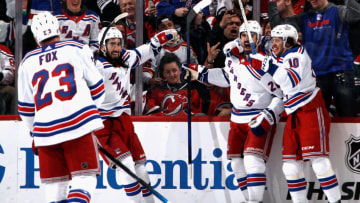 NEWARK, NEW JERSEY - APRIL 20: (L-R) Adam Fox #23, Mika Zibanejad #93, Chris Kreider #20 and Artemi Panarin #10 celebrate a powerplay goal by Kreider at 9:57 of the second period against the New Jersey Devils during Game Two in the First Round of the 2023 Stanley Cup Playoffs at the Prudential Center on April 20, 2023 in Newark, New Jersey. (Photo by Bruce Bennett/Getty Images)
