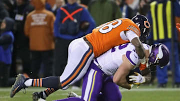 CHICAGO, IL - NOVEMBER 18: Roquan Smith #58 of the Chicago Bears brings down Kyle Rudolph #82 of the Minnesota Vikings at Soldier Field on November 18, 2018 in Chicago, Illinois. The Bears defeated the Vikings 25-20. (Photo by Jonathan Daniel/Getty Images)