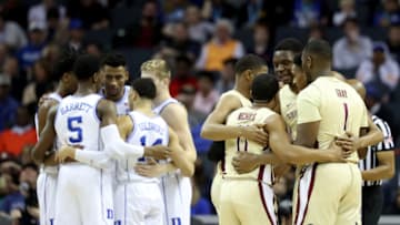 CHARLOTTE, NORTH CAROLINA - MARCH 16: The Duke Blue Devils and the Florida State Seminoles huddle against each other during the championship game of the 2019 Men's ACC Basketball Tournament at Spectrum Center on March 16, 2019 in Charlotte, North Carolina. (Photo by Streeter Lecka/Getty Images)