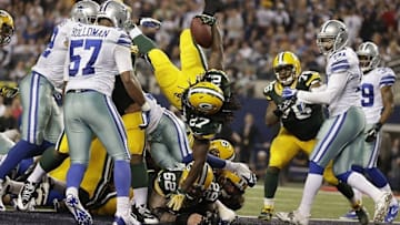 Dec 15, 2013; Arlington, TX, USA; Green Bay Packers running back Eddie Lacy (27) leaps for a touchdown in the fourth quarter of the game against the Dallas Cowboys at AT&T Stadium. Packers beat Cowboys 37-36. Mandatory Credit: Tim Heitman-USA TODAY Sports