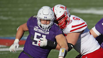 EVANSTON, ILLINOIS - NOVEMBER 07: Blake Gallagher #51 of the Northwestern Wildcats rushes against Boe Wilson #56 of the Nebraska Cornhuskers at Ryan Field on November 07, 2020 in Evanston, Illinois. Northwestern defeated Nebraska 21-13. (Photo by Jonathan Daniel/Getty Images)