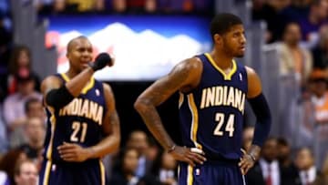 Jan 22, 2014; Phoenix, AZ, USA; Indiana Pacers forward Paul George (24) and forward David West react in the second half against the Phoenix Suns at US Airways Center. The Suns defeated the Pacers 124-100. Mandatory Credit: Mark J. Rebilas-USA TODAY Sports