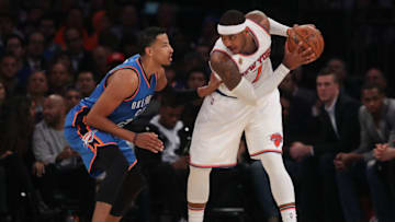 NEW YORK, NY - NOVEMBER 28: Carmelo Anthony #7 of the New York Knicks looks to pass around Andre Roberson #21 of the Oklahoma City Thunder during the second half at Madison Square Garden on November 28, 2016 in New York City. NOTE TO USER: User expressly acknowledges and agrees that, by downloading and or using this photograph, User is consenting to the terms and conditions of the Getty Images License Agreement. (Photo by Michael Reaves/Getty Images)