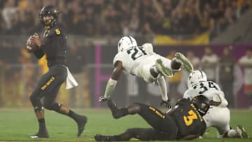 TEMPE, AZ - SEPTEMBER 08: Quarterback Manny Wilkins #5 of the Arizona State Sun Devils drops back to pass under pressure from linebacker Brandon Bouyer-Randle #26 of the Michigan State Spartans during the first half of the college football game at Sun Devil Stadium on September 8, 2018 in Tempe, Arizona. (Photo by Christian Petersen/Getty Images)