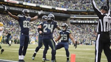 January 18, 2015; Seattle, WA, USA; Seattle Seahawks running back Marshawn Lynch (24) celebrates with wide receiver Ricardo Lockette (83) and wide receiver Doug Baldwin (89) after scoring a touchdown against the Green Bay Packers during the second half in the NFC Championship game at CenturyLink Field. Mandatory Credit: Kyle Terada-USA TODAY Sports