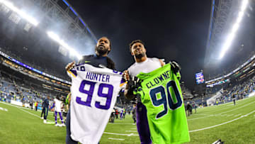 SEATTLE, WASHINGTON - DECEMBER 02: Jadeveon Clowney #90 of the Seattle Seahawks, left, and Danielle Hunter #99 of the Minnesota Vikings, right, exchange jerseys after the game at CenturyLink Field on December 02, 2019 in Seattle, Washington. The Seattle Seahawks won, 37-30. (Photo by Alika Jenner/Getty Images)