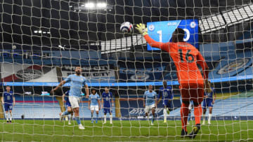 MANCHESTER, ENGLAND - MAY 08: Edouard Mendy of Chelsea saves a penalty taken by Sergio Aguero of Manchester City during the Premier League match between Manchester City and Chelsea at Etihad Stadium on May 08, 2021 in Manchester, England. Sporting stadiums around the UK remain under strict restrictions due to the Coronavirus Pandemic as Government social distancing laws prohibit fans inside venues resulting in games being played behind closed doors. (Photo by Shaun Botterill/Getty Images)