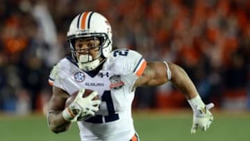 Jan 6, 2014; Pasadena, CA, USA; Auburn Tigers running back Tre Mason (21) scores a touchdown against the Florida State Seminoles during the second half of the 2014 BCS National Championship game at the Rose Bowl. Mandatory Credit: Jayne Kamin-Oncea-USA TODAY Sports