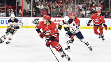 RALEIGH, NORTH CAROLINA - FEBRUARY 16: Teuvo Teravainen #86 of the Carolina Hurricanes moves the puck against the Edmonton Oilers during the second period at PNC Arena on February 16, 2020 in Raleigh, North Carolina. The Oilers won 4-3 in overtime. (Photo by Grant Halverson/Getty Images)