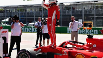 MONTREAL, QC - JUNE 09: Pole position qualifier Sebastian Vettel of Germany and Ferrari celebrates in parc ferme during qualifying for the Canadian Formula One Grand Prix at Circuit Gilles Villeneuve on June 9, 2018 in Montreal, Canada. (Photo by Dan Istitene/Getty Images)