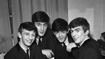 The Beatles pose for an eraly group portrait, backstage, (L-R) Ringo Starr, John Lennon, Paul McCartney, George Harrison, 1962. (Photo by Harry Hammond/V&A Images/Getty Images)