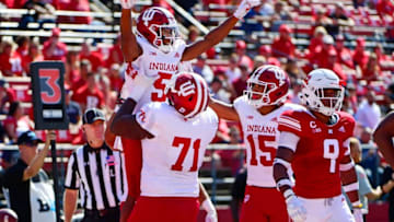 PISCATAWAY, NJ - SEPTEMBER 29: J-Shun Harris II #5 of the Indiana Hoosiers is hoisted by teammate Delroy Baker #71 after scoring a touchdown against the Rutgers Scarlet Knights during the second quarter at HighPoint.com Stadium on September 29, 2018 in Piscataway, New Jersey. (Photo by Corey Perrine/Getty Images)