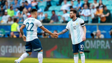 PORTO ALEGRE, BRAZIL - JUNE 23: Lautaro Martinez of Argentina celebrates with Lionel Messi of Argentina after scoring the opening goal during the Copa America Brazil 2019 group B match between Qatar and Argentina at Arena do Gremio on June 23, 2019 in Porto Alegre, Brazil. (Photo by Alessandra Cabral/Getty Images)