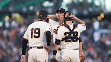 Jun 27, 2016; San Francisco, CA, USA; San Francisco Giants starting pitcher Jeff Samardzija (29) with pitching coach Dave Righetti (19) and catcher Buster Posey (28) after allowing five runs by the Oakland Athletics during the second inning at AT&T Park. Mandatory Credit: Kelley L Cox-USA TODAY Sports