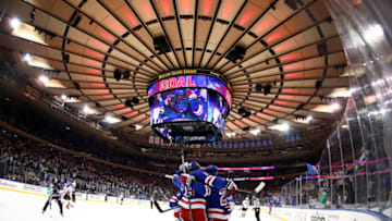 NEW YORK, NEW YORK - DECEMBER 19: The New York Rangers celebrate a goal by Paul Carey