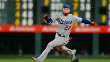 DENVER, CO - APRIL 6: Alex Verdugo #27 of the Los Angeles Dodgers looses his helmet on his way to an RBI triple during the eighth inning against the Colorado Rockies at Coors Field on April 6, 2019 in Denver, Colorado. (Photo by Justin Edmonds/Getty Images)