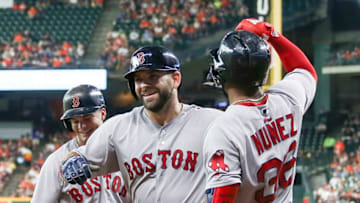HOUSTON, TX - JUNE 03: Mitch Moreland #18 of the Boston Red Sox is congratulated by Eduardo Nunez #36 and Andrew Benintendi #16 after hitting a home run in the first inning against the Houston Astros at Minute Maid Park on June 3, 2018 in Houston, Texas. (Photo by Bob Levey/Getty Images)