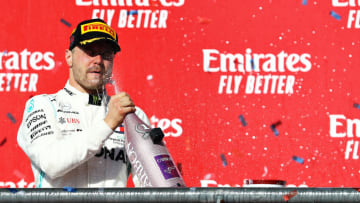 AUSTIN, TEXAS - NOVEMBER 03: Race winner Valtteri Bottas of Finland and Mercedes GP celebrates on the podium during the F1 Grand Prix of USA at Circuit of The Americas on November 03, 2019 in Austin, Texas. (Photo by Mark Thompson/Getty Images)