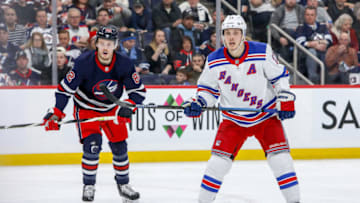 WINNIPEG, MB - FEBRUARY 11: Mason Appleton #82 of the Winnipeg Jets and Jesper Fast #17 of the New York Rangers keep an eye on the play during second period action at the Bell MTS Place on February 11, 2020 in Winnipeg, Manitoba, Canada. (Photo by Jonathan Kozub/NHLI via Getty Images)