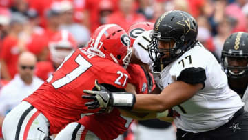 Oct 15, 2016; Athens, GA, USA; Vanderbilt Commodores defensive tackle Nifae Lealao (77) tackles Georgia Bulldogs running back Nick Chubb (27) during the second quarter at Sanford Stadium. Mandatory Credit: Dale Zanine-USA TODAY Sports