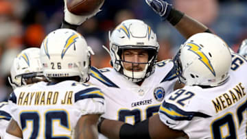 DENVER, COLORADO - DECEMBER 30: Joey Bosa #99 of the Los Angeles Chargers celebrates a fumble recovery against the Denver Broncos at Broncos Stadium at Mile High on December 30, 2018 in Denver, Colorado. (Photo by Matthew Stockman/Getty Images)