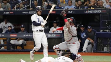 Oct 7, 2021; St. Petersburg, Florida, USA; Tampa Bay Rays right fielder Randy Arozarena (56) steals home in front of Boston Red Sox catcher Christian Vázquez (7) during the 7th inning of game one of the 2021 ALDS at Tropicana Field. Mandatory Credit: Mike Watters-USA TODAY Sports