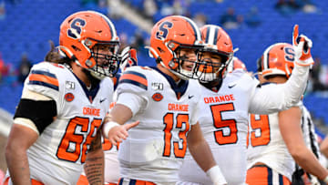 DURHAM, NORTH CAROLINA - NOVEMBER 16: Tommy DeVito #13 of the Syracuse Orange celebrates with teammates after scoring a touchdown against the Duke Blue Devils during the first quarter of their game at Wallace Wade Stadium on November 16, 2019 in Durham, North Carolina. (Photo by Grant Halverson/Getty Images)