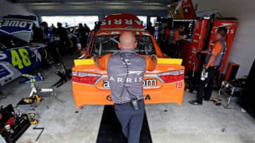Nov 19, 2016; Homestead, FL, USA; Crew member for NASCAR Sprint Cup Series driver Carl Edwards (19) wait in the garage during practice for the Ford Ecoboost 400 at Homestead-Miami Speedway. Mandatory Credit: Peter Casey-USA TODAY Sports