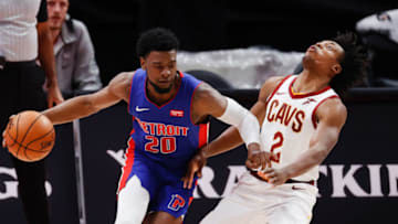 Apr 19, 2021; Detroit, Michigan, USA; Detroit Pistons guard Josh Jackson (20) dribbles on Cleveland Cavaliers guard Collin Sexton (2) in the second half at Little Caesars Arena. Mandatory Credit: Rick Osentoski-USA TODAY Sports