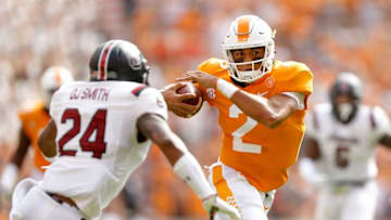 KNOXVILLE, TN - OCTOBER 14: Jarrett Guarantano #2 of the Tennessee Volunteers runs with the ball defended by D.J. Smith #24 of the South Carolina Gamecocks during the first half at Neyland Stadium on October 14, 2017 in Knoxville, Tennessee. (Photo by Michael Reaves/Getty Images)