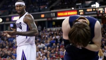 Nov 18, 2014; Sacramento, CA, USA; Sacramento Kings center DeMarcus Cousins (15) reacts after being called for a foul against New Orleans Pelicans forward Luke Babbitt (8) during the first quarter at Sleep Train Arena. Mandatory Credit: Kelley L Cox-USA TODAY Sports