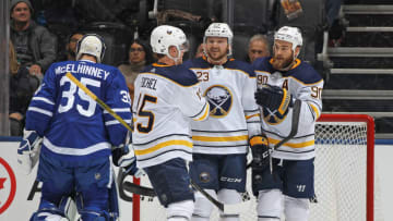 TORONTO, ON - APRIL 2: Sam Reinhart #23 of the Buffalo Sabres celebrates a goal with teammates Jack Eichel #15 and Ryan O'Reilly #90 against the Toronto Maple Leafs during an NHL game at the Air Canada Centre on April 2, 2018 in Toronto, Ontario, Canada. (Photo by Claus Andersen/Getty Images)