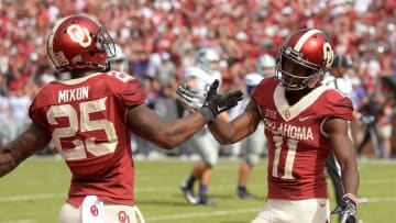 Oct 15, 2016; Norman, OK, USA; Oklahoma Sooners wide receiver Dede Westbrook (11) and Oklahoma Sooners running back Joe Mixon (25) celebrate a touchdown against the Kansas State Wildcats during the third quarter at Gaylord Family - Oklahoma Memorial Stadium. Mandatory Credit: Mark D. Smith-USA TODAY Sports