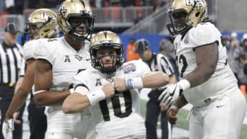 ATLANTA, GA - JANUARY 01: UCF Golden Knights quarterback McKenzie Milton (10) celebrates a touchdown during the Chick-fil-A Peach Bowl between the UCF Knights and the Auburn War Eagles on January 1, 2017 at Mercedes-Benz stadium in Atlanta, GA. (Photo by David J. Griffin/Icon Sportswire via Getty Images)