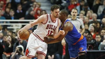 Jan 1, 2016; Chicago, IL, USA; Chicago Bulls center Pau Gasol (16) works against New York Knicks center Kevin Seraphin (1) during the second half at United Center. The Bulls won 108-81. Mandatory Credit: Kamil Krzaczynski-USA TODAY Sports