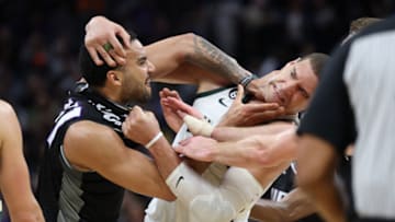 Sacramento Kings center Trey Lyles (41) confronts Milwaukee Bucks center Brook Lopez. Mandatory Credit: Kelley L Cox-USA TODAY Sports