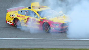BROOKLYN, MICHIGAN - JUNE 10: Joey Logano, driver of the #22 Shell Pennzoil Ford, celebrates with a burnout after winning the Monster Energy NASCAR Cup Series FireKeepers Casino 400 at Michigan International Speedway on June 10, 2019 in Brooklyn, Michigan. (Photo by Stacy Revere/Getty Images)