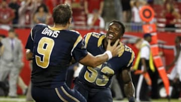 Sep 14, 2014; Tampa, FL, USA; St. Louis Rams quarterback Austin Davis (9) and linebacker Daren Bates (53) celebrate as time expires in the game against the Tampa Bay Buccaneers at Raymond James Stadium. St. Louis Rams defeated the Tampa Bay Buccaneers 19-17. Mandatory Credit: Kim Klement-USA TODAY Sports