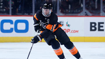 PHILADELPHIA, PENNSYLVANIA - DECEMBER 18: Sean Couturier #14 of the Philadelphia Flyers skates with the puck against the Ottawa Senators at Wells Fargo Center on December 18, 2021 in Philadelphia, Pennsylvania. (Photo by Tim Nwachukwu/Getty Images)
