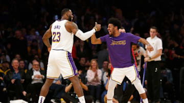 LOS ANGELES, CALIFORNIA - DECEMBER 08: LeBron James #23 of the Los Angeles Lakers celebrates a three-pointer Quinn Cook #2 of the Los Angeles Lakers during the fourth quarter against the Minnesota Timberwolves with at Staples Center on December 08, 2019 in Los Angeles, California. NOTE TO USER: User expressly acknowledges and agrees that, by downloading and or using this photograph, User is consenting to the terms and conditions of the Getty Images License Agreement. (Photo by Katharine Lotze/Getty Images)