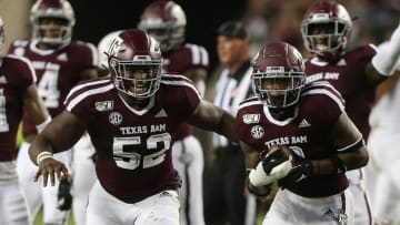COLLEGE STATION, TEXAS - AUGUST 29: Bryan London II #9 of the Texas State Bobcats celebrates with Justin Madubuike #52 after an interception against the Texas State Bobcats during the first half at Kyle Field on August 29, 2019 in College Station, Texas. (Photo by Bob Levey/Getty Images)