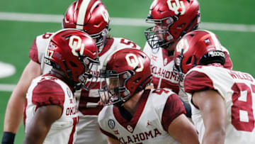 Dec 19, 2020; Arlington, Texas, USA; Oklahoma Sooners quarterback Chandler Morris (4) celebrates a touchdown with his teammates in the first quarter against the Iowa State Cyclones at AT&T Stadium. Mandatory Credit: Tim Heitman-USA TODAY Sports