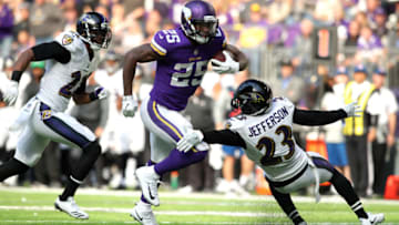 MINNEAPOLIS, MN - OCTOBER 22: Latavius Murray #25 of the Minnesota Vikings runs with the ball and breaks a tackle by defender Tony Jefferson #23 of the Baltimore Ravens in the third quarter of the game on October 22, 2017 at U.S. Bank Stadium in Minneapolis, Minnesota. Murray scored a 29 yard touchdown on the play. (Photo by Adam Bettcher/Getty Images)