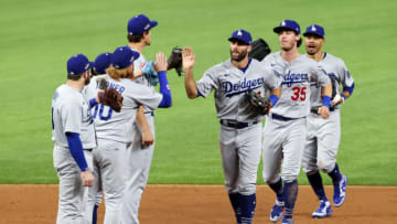 ARLINGTON, TEXAS - OCTOBER 08: Chris Taylor #3 of the Los Angeles Dodgers celebrates with teammates after defeating the San Diego Padres 12-3 in Game Three of the National League Division Series to advance to the National League Championship Series at Globe Life Field on October 08, 2020 in Arlington, Texas. (Photo by Tom Pennington/Getty Images)