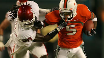 MIAMI - OCTOBER 03: Running back Javarris James #5 of the Miami Hurricanes is brought down by defensive back Quinton Carter #20 of the Oklahoma Sooners on October 3, 2009 in Miami, Florida. Miami defeated Okalahoma 21-20. (Photo by Marc Serota/Getty Images)