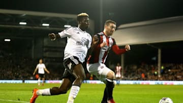 LONDON, ENGLAND - MARCH 06: Sheyi Ojo of Fulham and Jack O'Connell of Sheffield United in action during the Sky Bet Championship match between Fulham and Sheffield United at Craven Cottage on March 6, 2018 in London, England. (Photo by Alex Pantling/Getty Images)