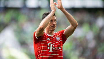 Robert Lewandowski shows appreciation to the fans during the Bundesliga match between VfL Wolfsburg and FC Bayern München at Volkswagen Arena on May 14, 2022 in Wolfsburg, Germany. (Photo by Marvin Ibo Guengoer - GES Sportfoto/Getty Images)